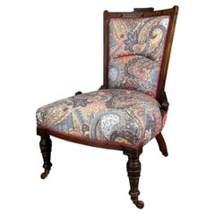 Edwardian Mahogany Nursing Chair with Original Casters and Paisley Upholstery