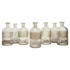 Set of Eight Early to Mid-20th Century Etched Glass Apothecary Bottles