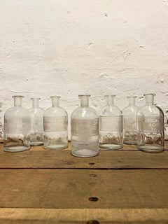 Set of Eight Early to Mid-20th Century Etched Glass Apothecary Bottles