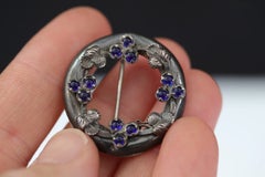 Arts and Crafts Silver Foliate Annular Brooch with Blue Cabochons