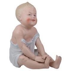 German Bisque Porcelain Piano Baby Figurine Attributed to Heubach