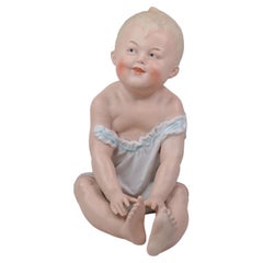 German Bisque Porcelain Piano Baby Figurine Attributed to Heubach