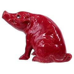 Antique Sang de Boeuf Glazed Ceramic Seated Pig Figurine with Glass Eyes