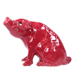 Antique Sang de Boeuf Glazed Ceramic Seated Pig Figurine with Glass Eyes