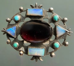 Arts and Crafts Silver Openwork Brooch with Garnet, Opals and Turquoise