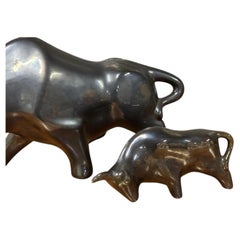 Mid Century Pair of Retro Black Glazed Ceramic Charging Bull Figurines