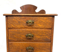 Antique Oak Tabletop Four-Drawer Collector's Cabinet with Shaped Upstand