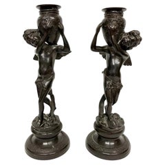 Antique Pair of Patinated Bronze Cherub Candlesticks with Amphora Sockets