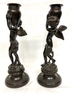 Antique Pair of Patinated Bronze Cherub Candlesticks with Amphora Sockets