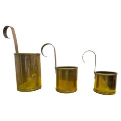 Set of Three British Brass and Copper Hanging Milk Measures, 250ml to 750ml
