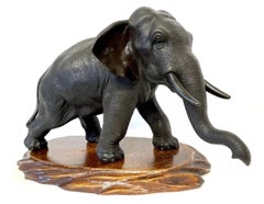 Antique Japanese Bronze Meiji Okimono of an Elephant with Carved Wooden Base