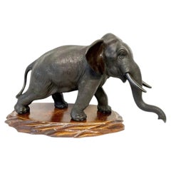 Antique Japanese Bronze Meiji Okimono of an Elephant with Carved Wooden Base