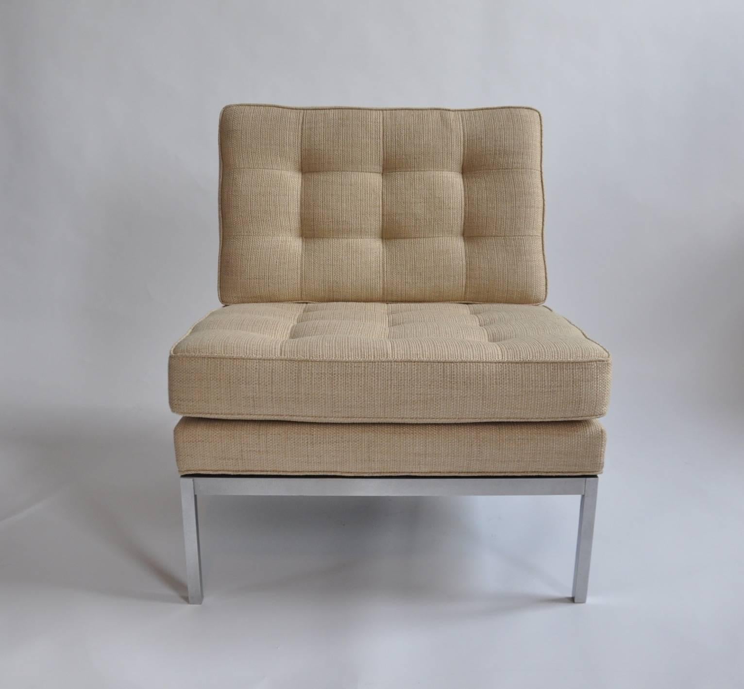 Pair of upholstered lounge chair with stainless base by Florence Knoll, Knoll.