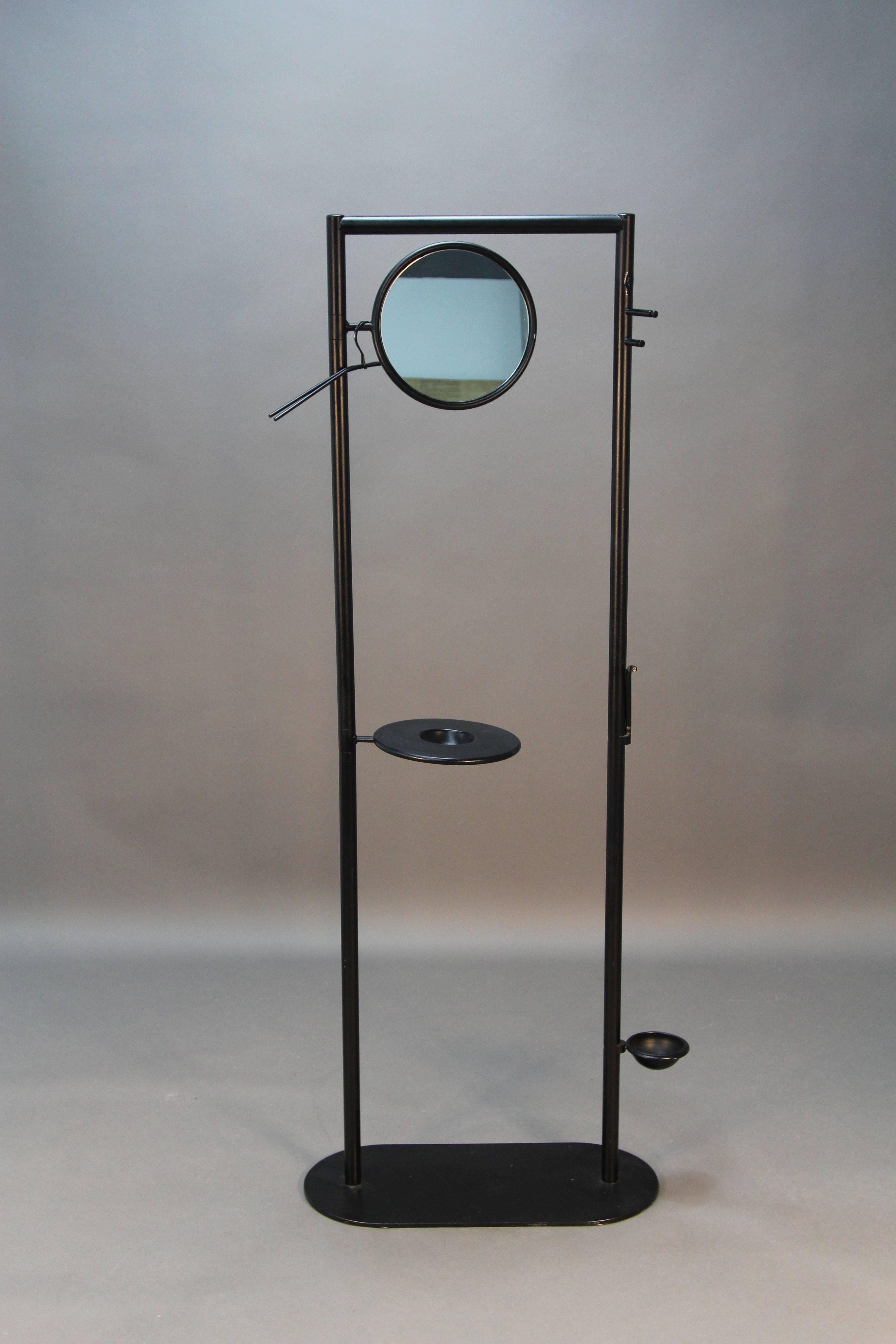 Designer coatrack from Fly Line in Carre Italy with swivel mirror, change or key cup, and swivel umbrella receiver.