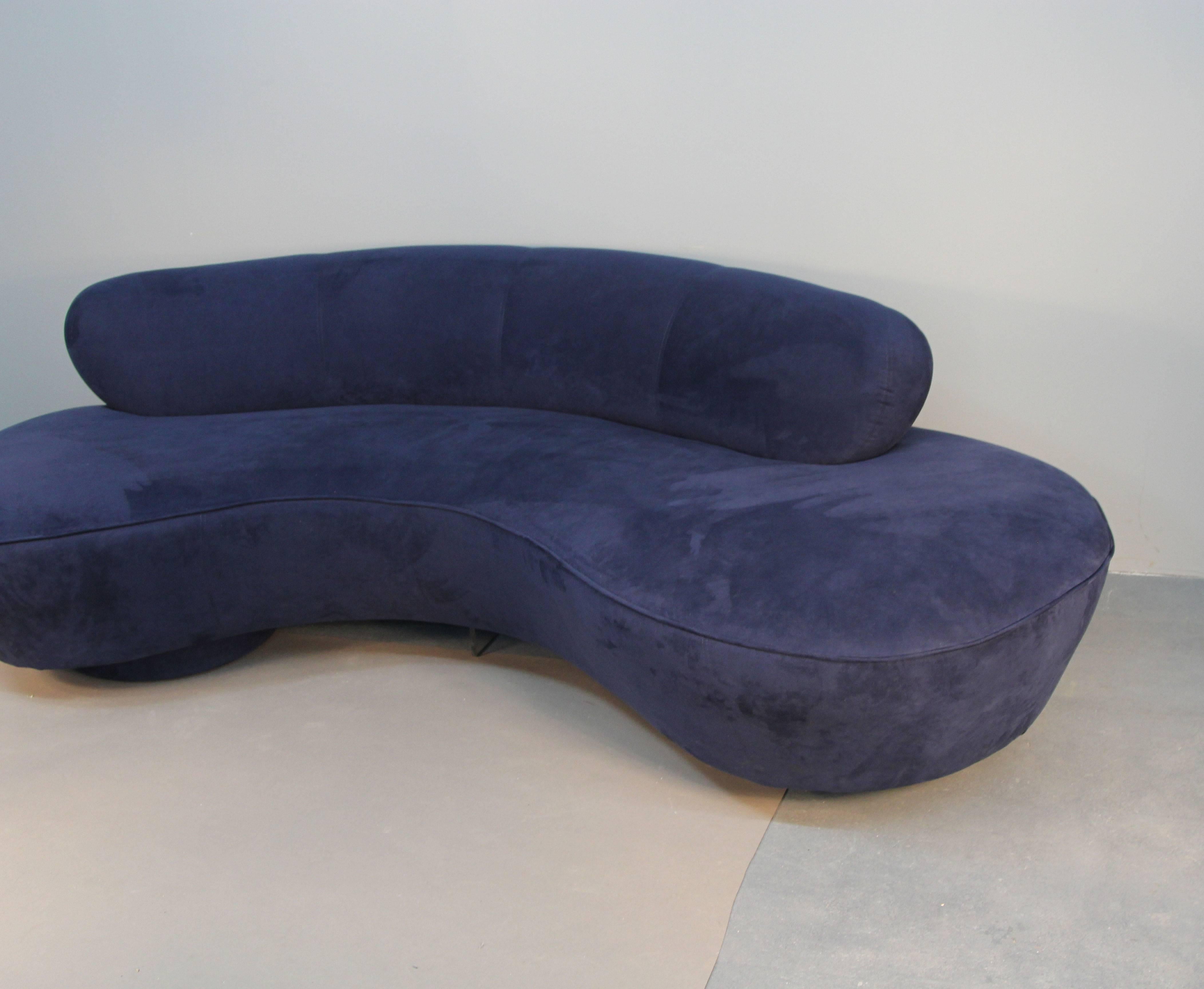 Vladimir Kagan cloud sofa, in navy blue ultrasuede. With Lucite center support.