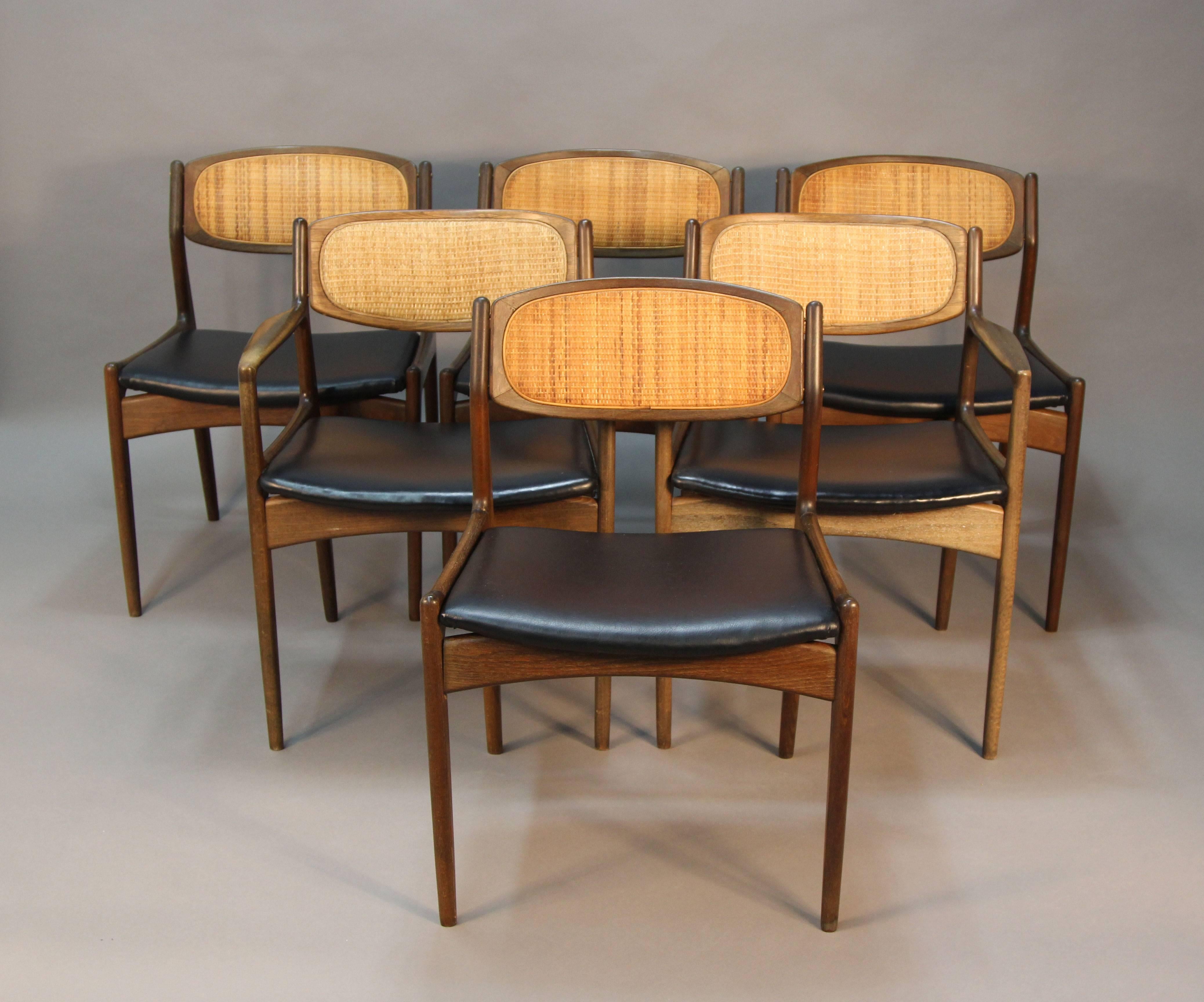 Signed Selig, these dining chairs are in excellent condition, no issues with any caning. Walnut frames with vinyl seats.