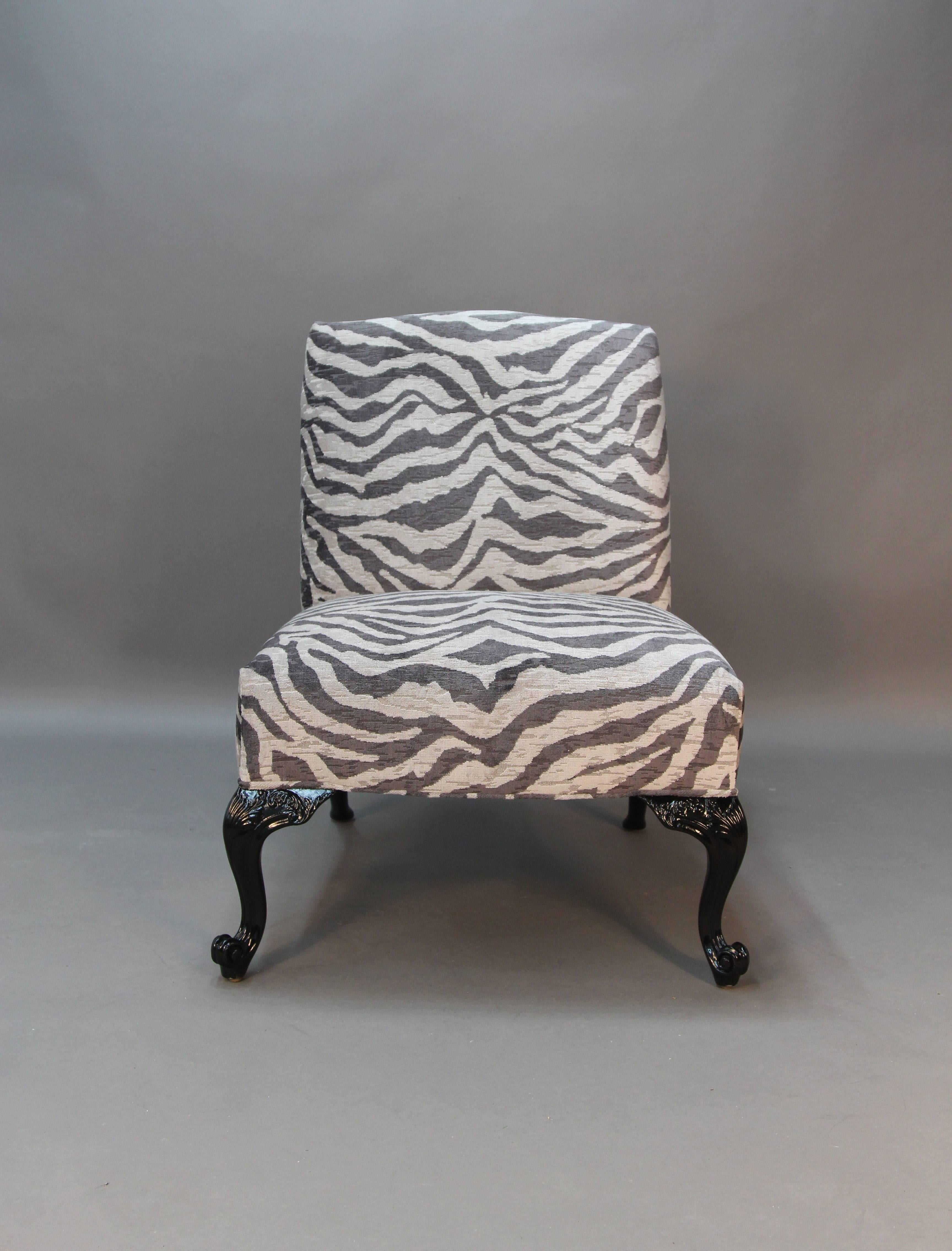 A more modern twist on a traditional pair of chairs. The frames are newly lacquered and the seats have been newly upholstered in zebra print grey tone fabric.