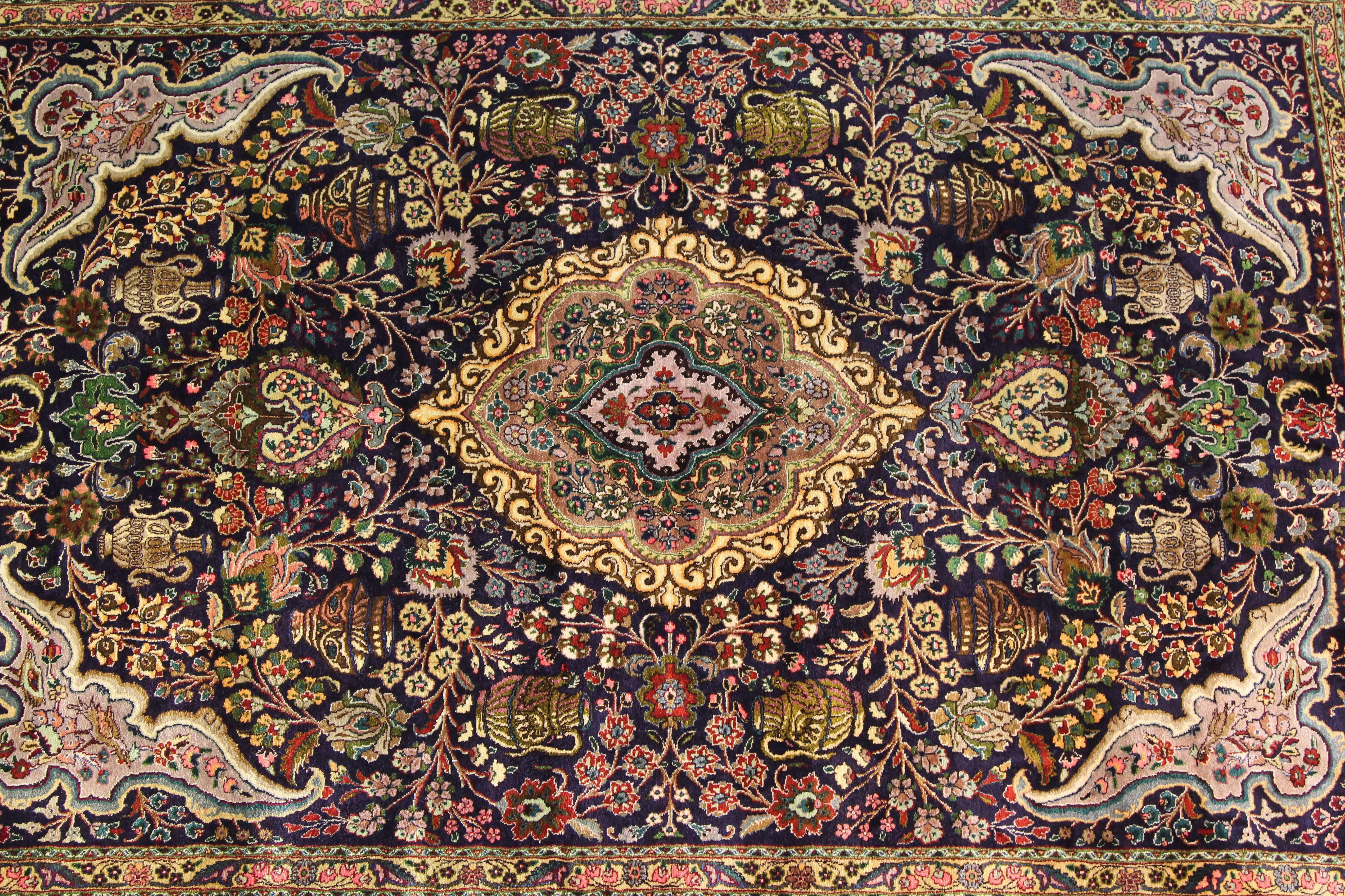 A rare, super fine 1950 silk persian rug with vibrant colors and organic design.  Handmade, never walked on, always hung for decoration.  