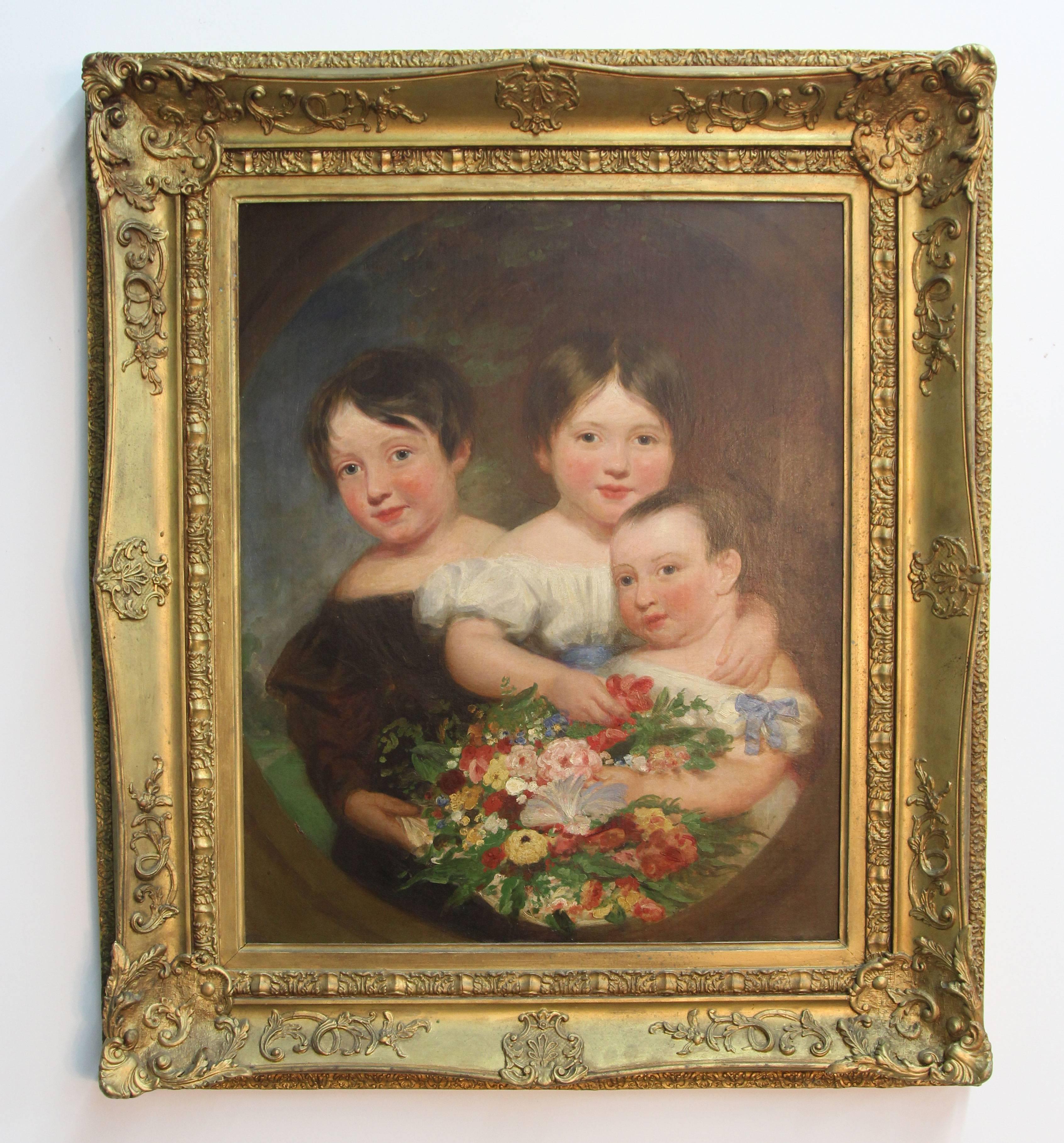 A portrait of children and baby holding a bouquet of flowers. Antique giltwood frame.