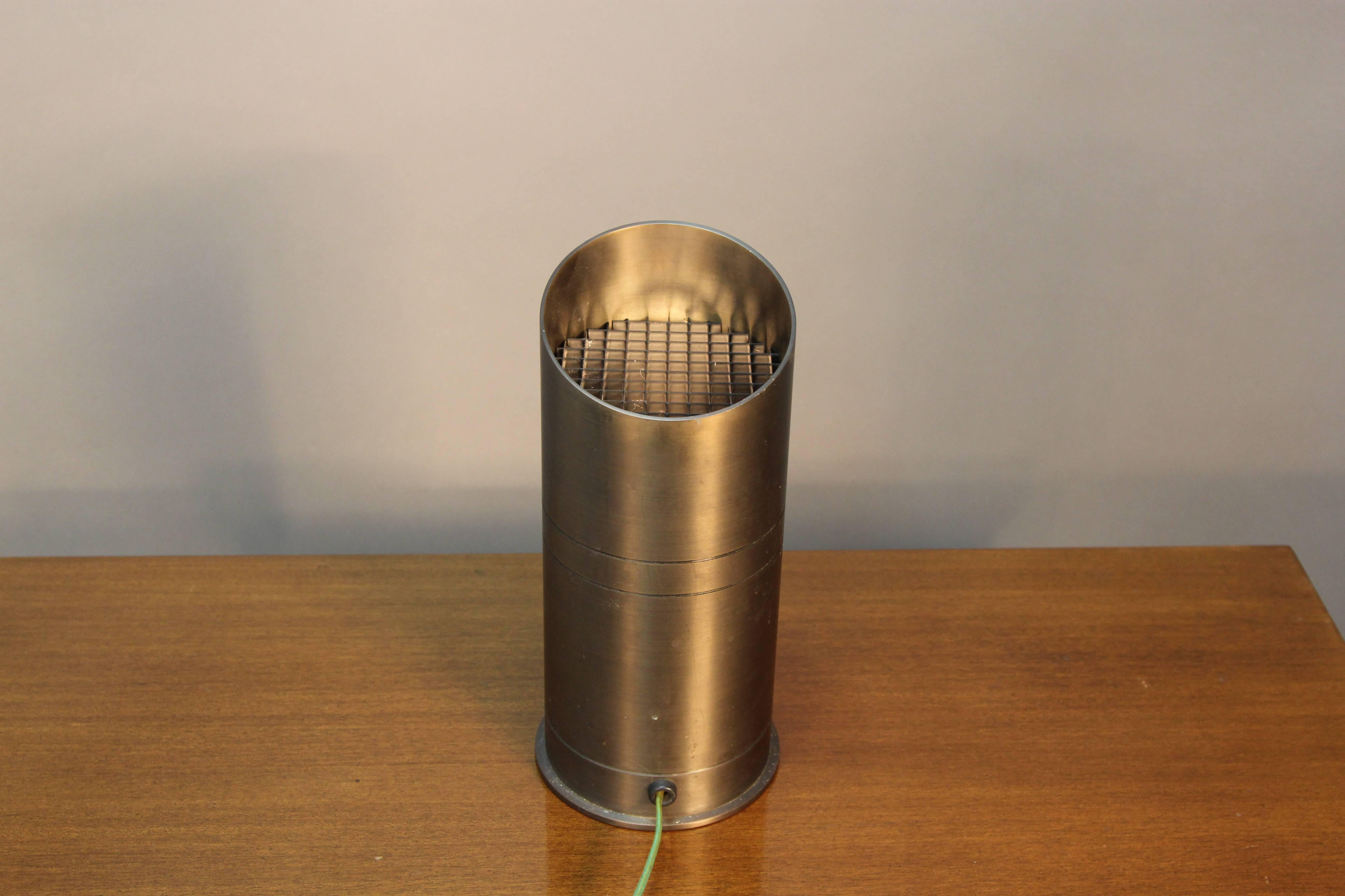 Angled up light canister with dark bronzed satin finish.
