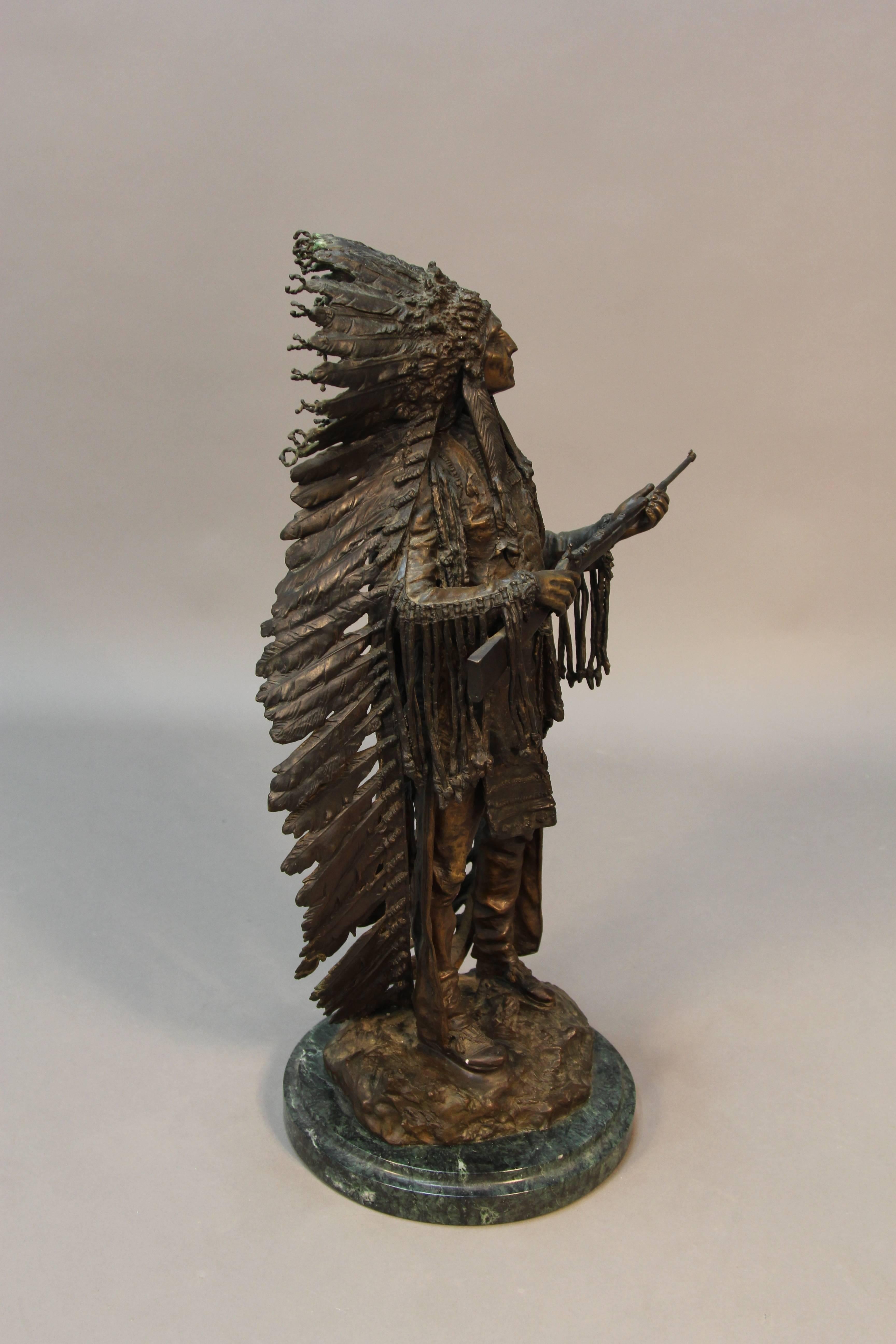 American Indian statue by Carl Kauba in 1910. Austrian sculptor know for Western Native American sculpture. This bronze piece is textured and very naturalistic.