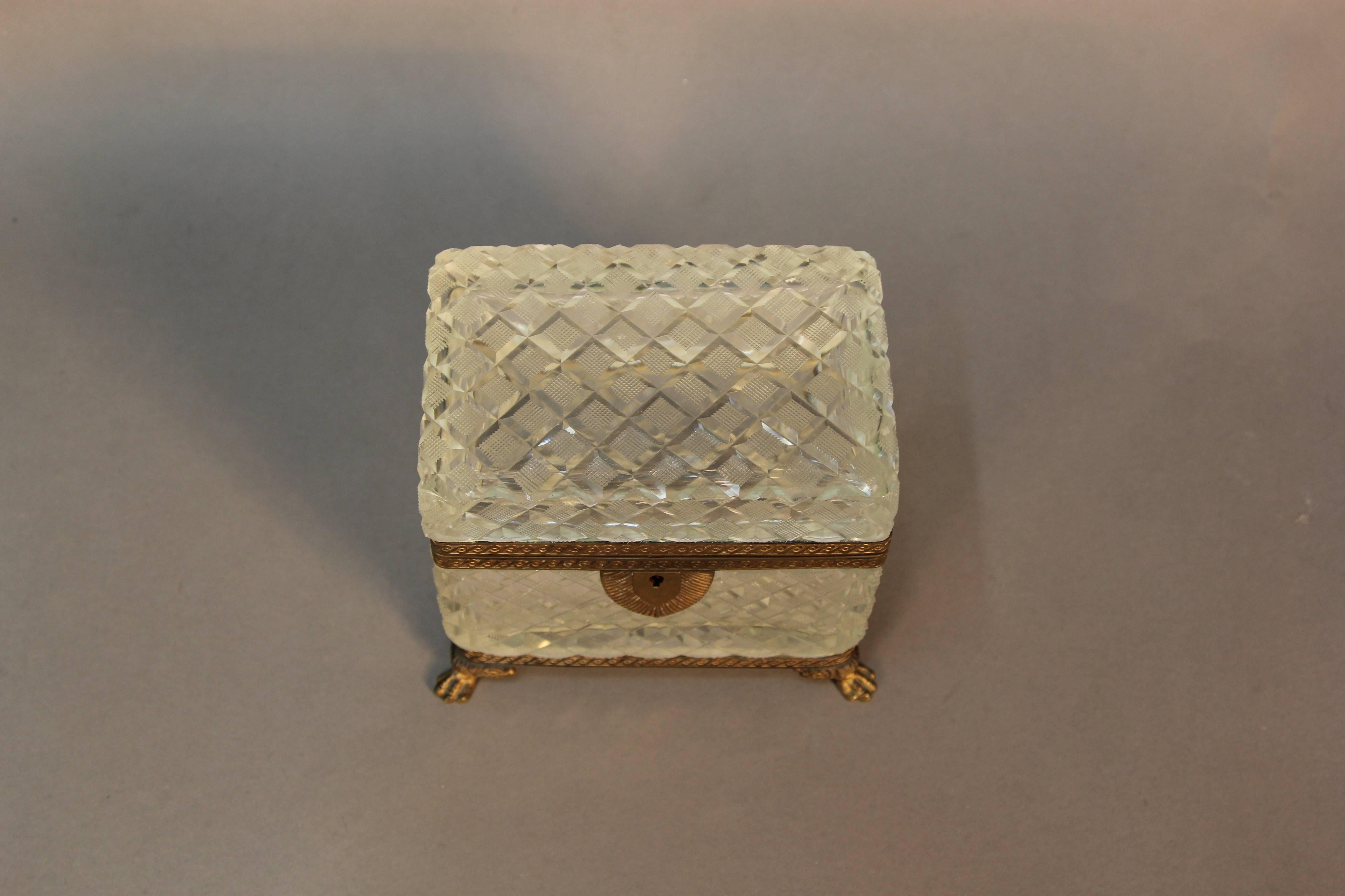 A rare antique cut diamond crystal and dore bronze jewel box/ casket. Gilt dore bronze mounts, nicely aged showing antique patina. With animal paw feet.
