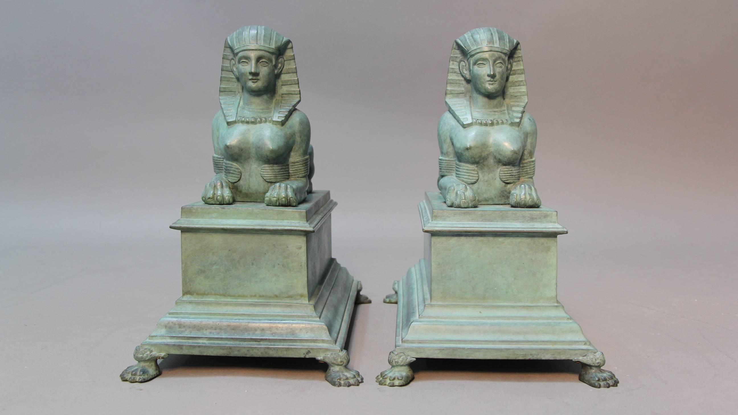 A circa 1900 large pair of patinated French bronze Egyptian revival sphinx sculptures. Realistically formed with extreme attention to detail.
