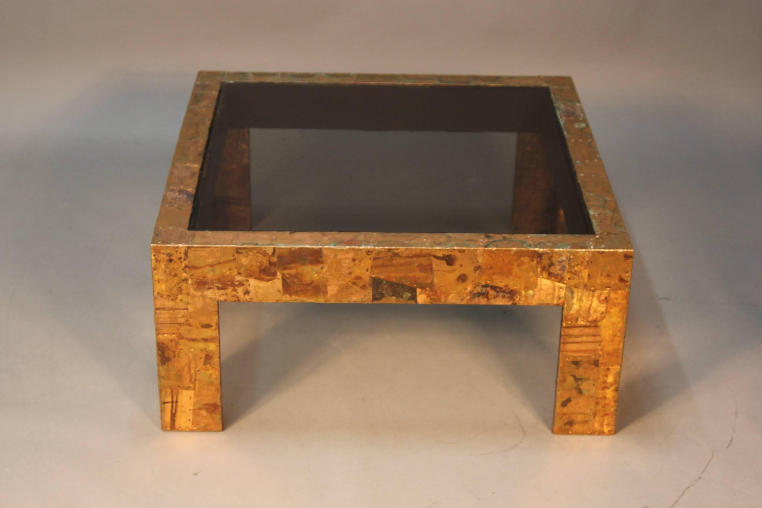 Paul Evans hammered patchwork copper coffee table. With inset smoked glass, which may not be original to the table.