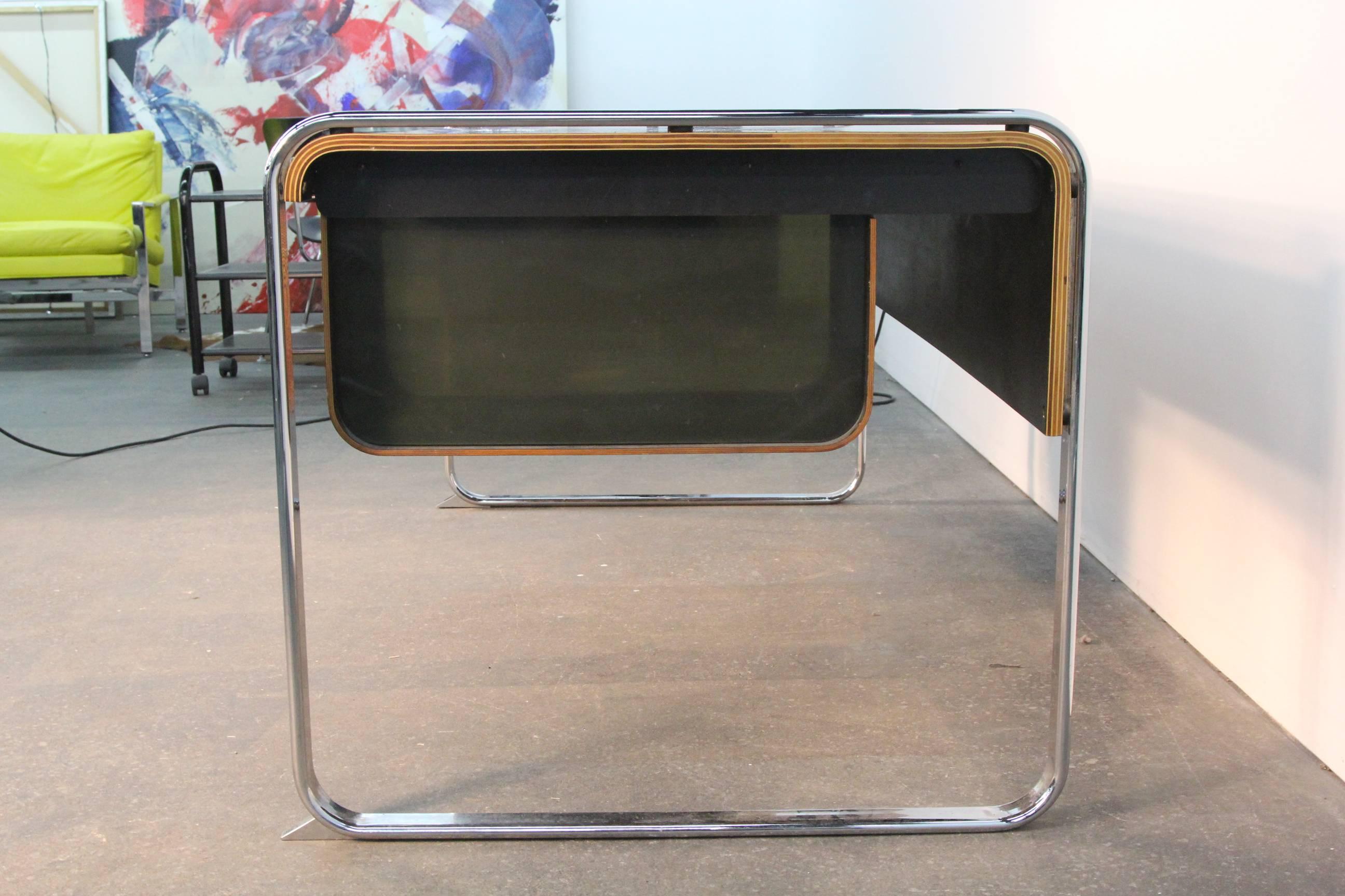 Beautiful zebra wood with incredible wood grain. Chrome frame with two file drawers and center drawer with pencil holder and office item sections. Design by Peter Protzman for Herman Miller.