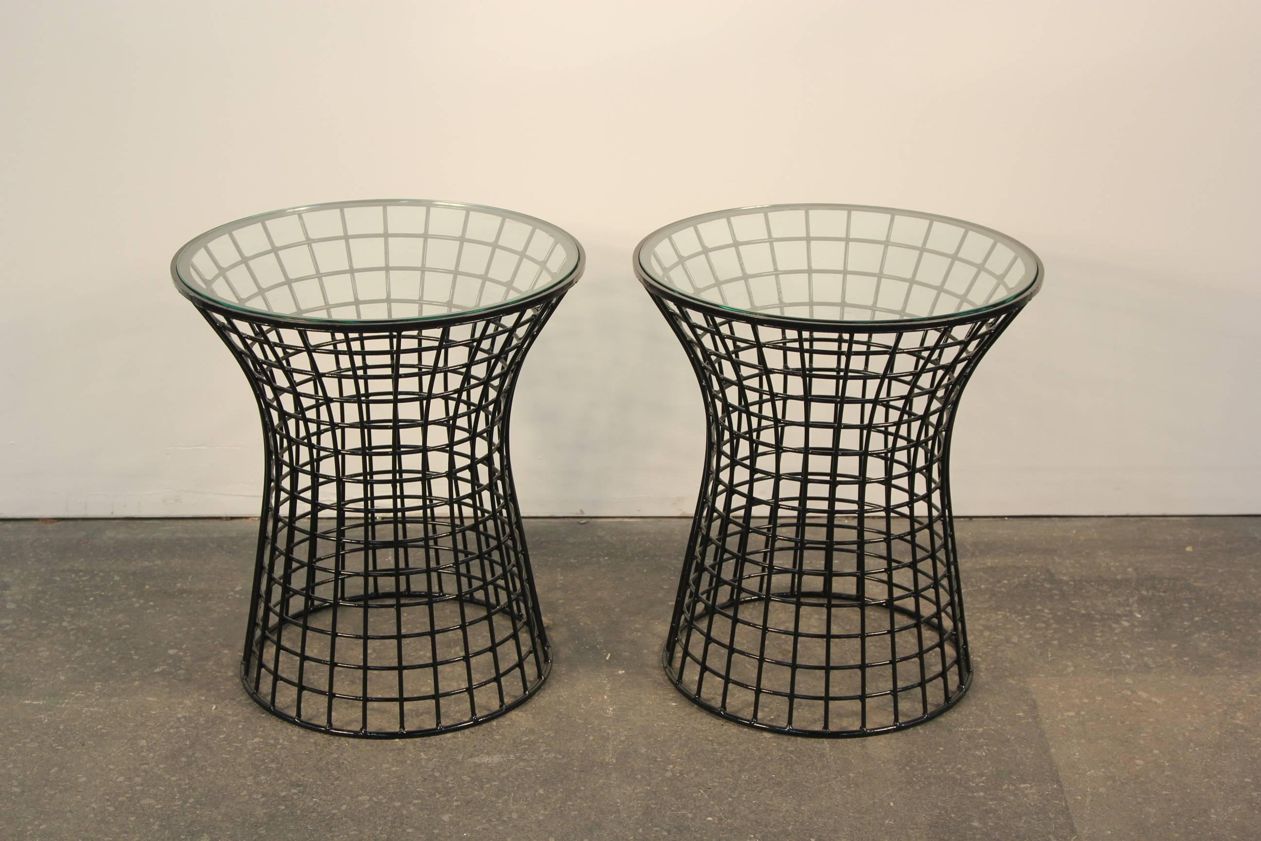 Pair of fluted grid iron end tables with glass tops. Newly lacquered black. Inspired by the iconic Warren Platner end tables.