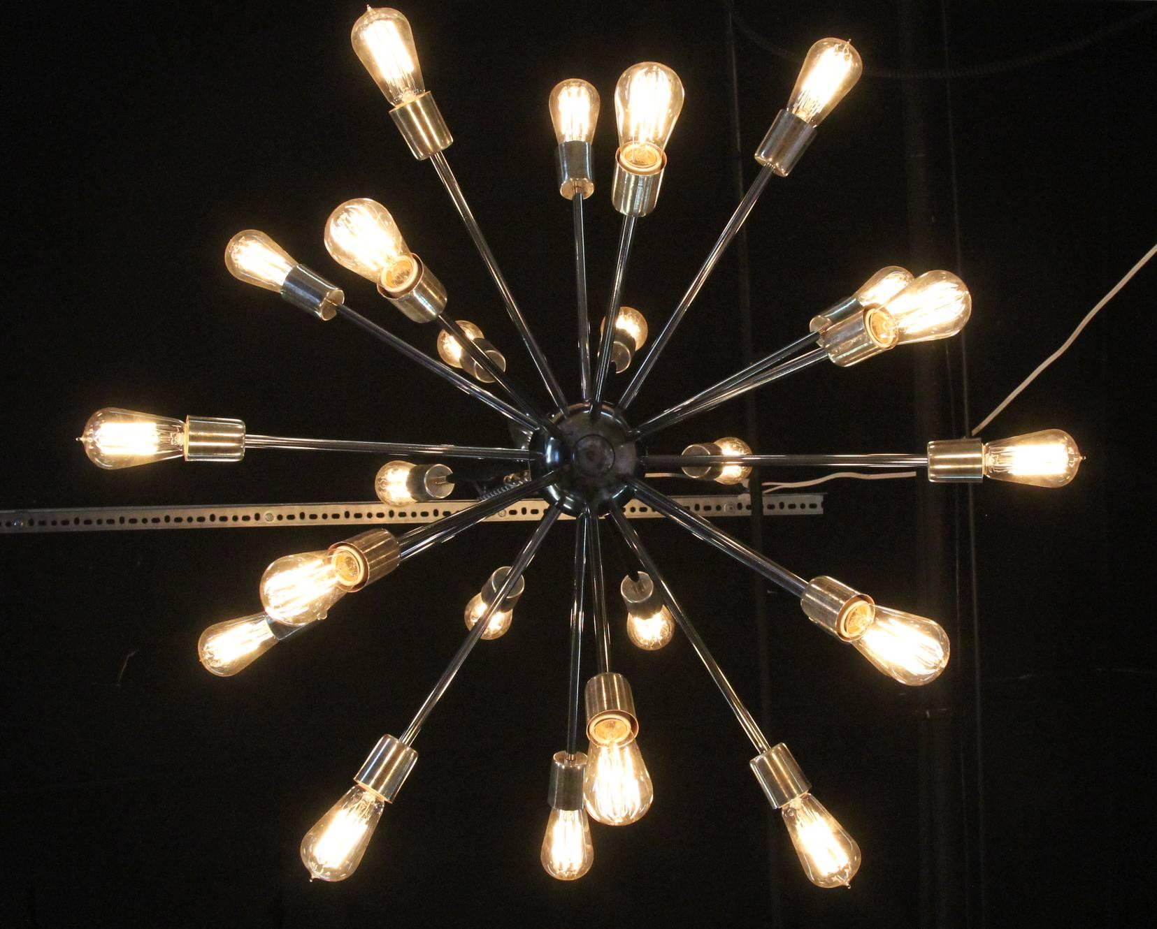 Incredible pair of vintage Sputnik chandeliers completely rewired for US modern lighting. Comes with brand new Edison style bulbs. Incredible statement pieces of lighting. Can purchase two matching or a single.