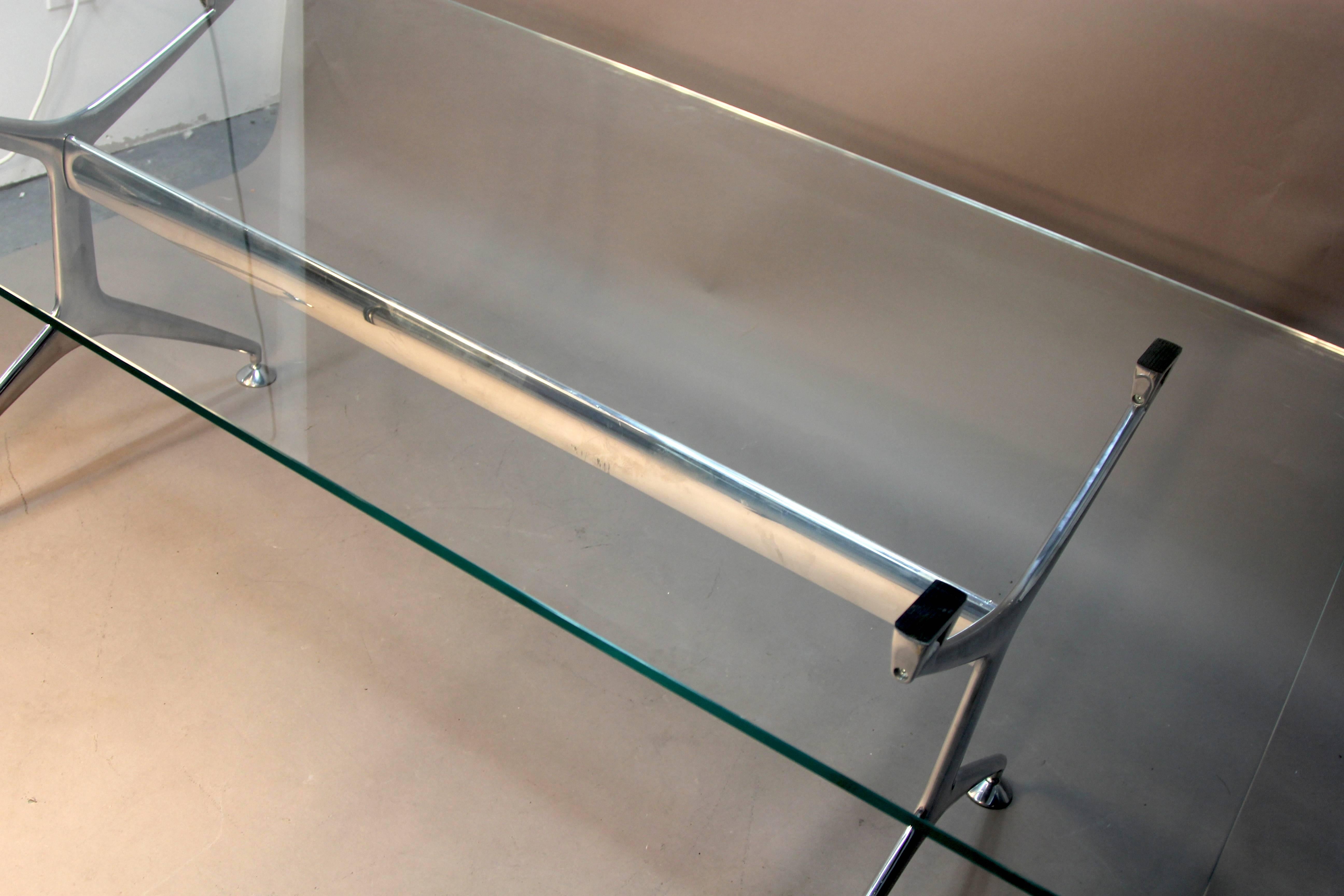 Very stylish and functional, the chrome base can accommodate a number of different tops. Included is a glass top measures 36 x 72 perfect for an office desk. Sleek lines and beautiful design make this a statement piece in any office or dining room.
