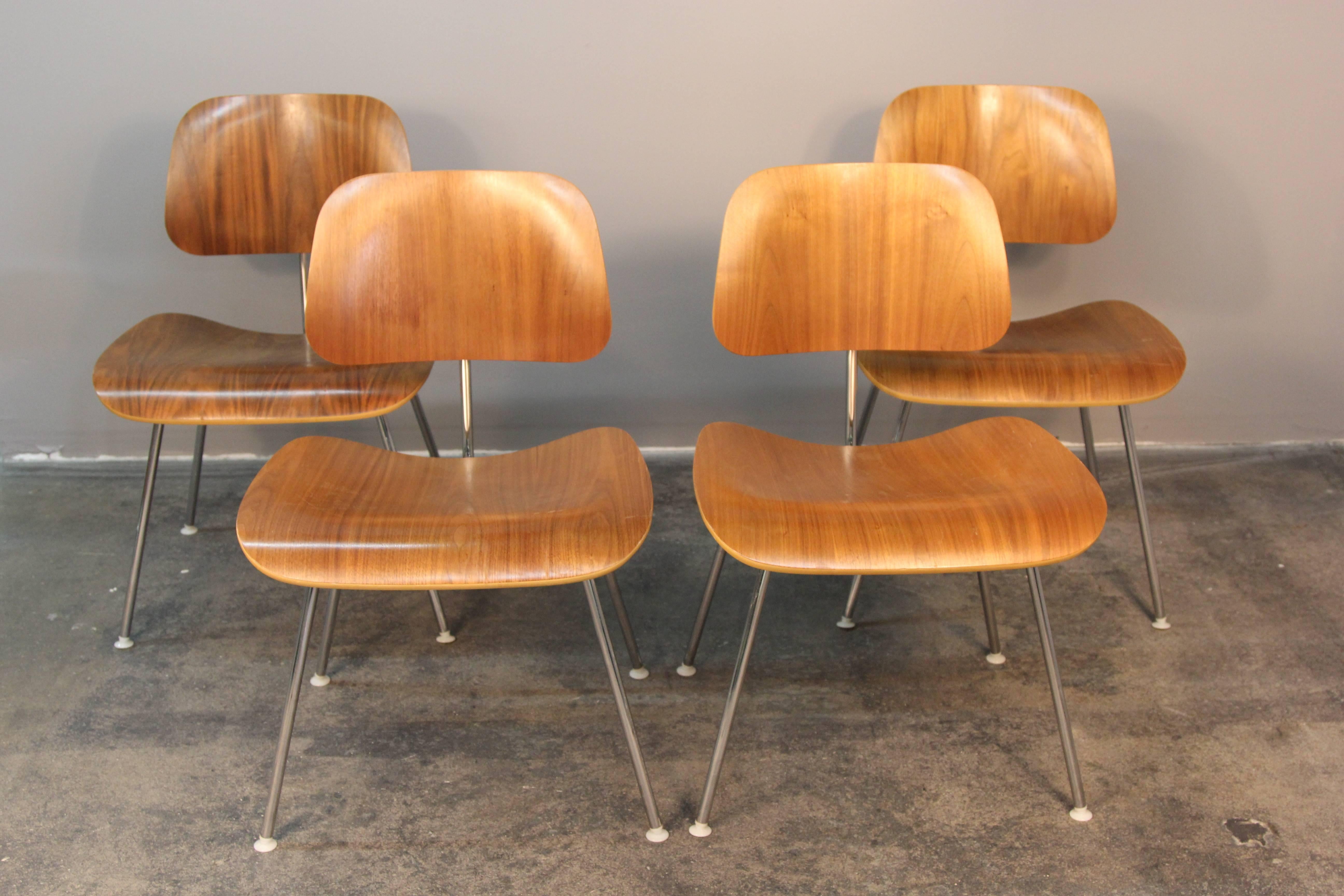 Incredible condition, set of four Eames DCM chairs. An iconic style for any environment.