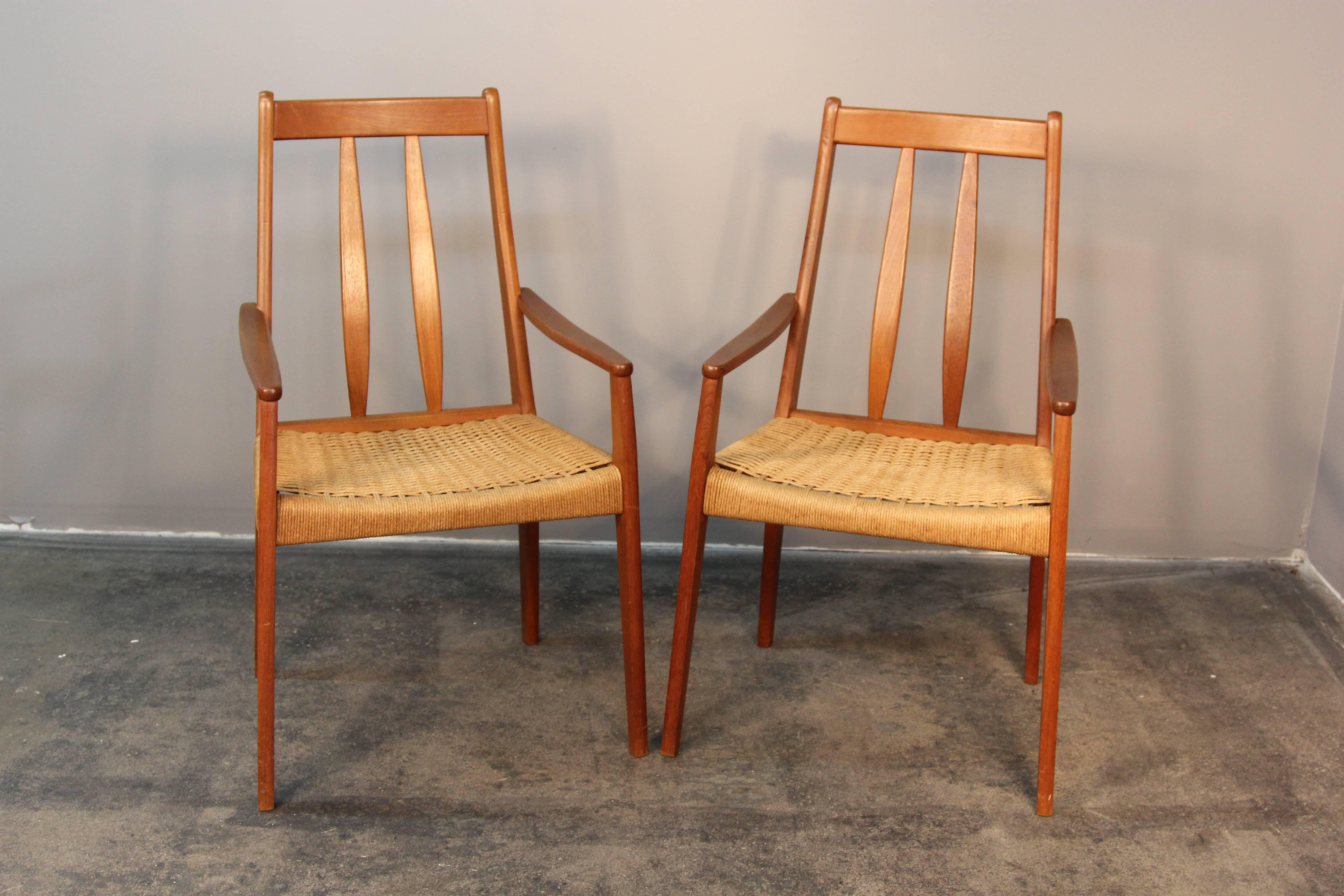 Excellent head of table dining chairs, or occasional chairs. Teak wood frame with Danish cord seats.