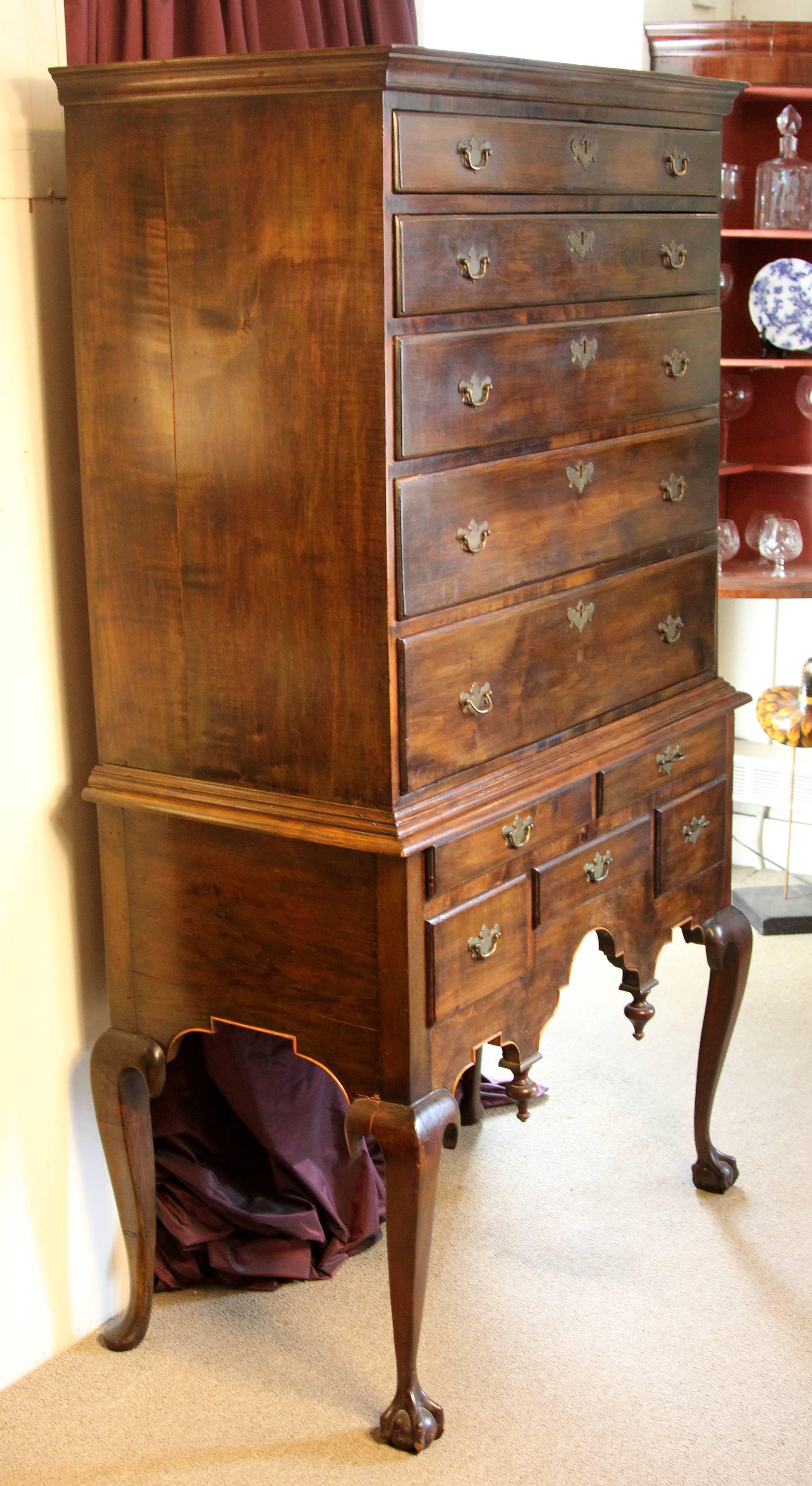 Circa 1725, cabriole legs - period brass pulls  Apron configuration on claw and ball feet.  There are seven rows of dovetailed drawers each open smoothly.