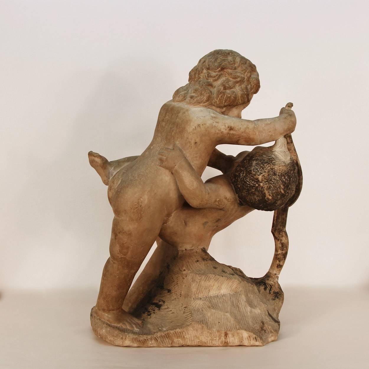 18th Century and Earlier 17th Century Sculpture of Putto at Play For Sale