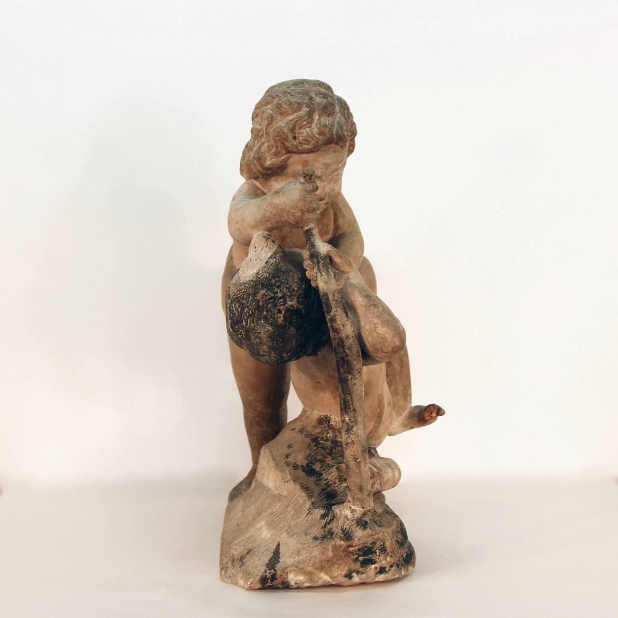 17th Century Sculpture of Putto at Play In Good Condition For Sale In Bridport, CT