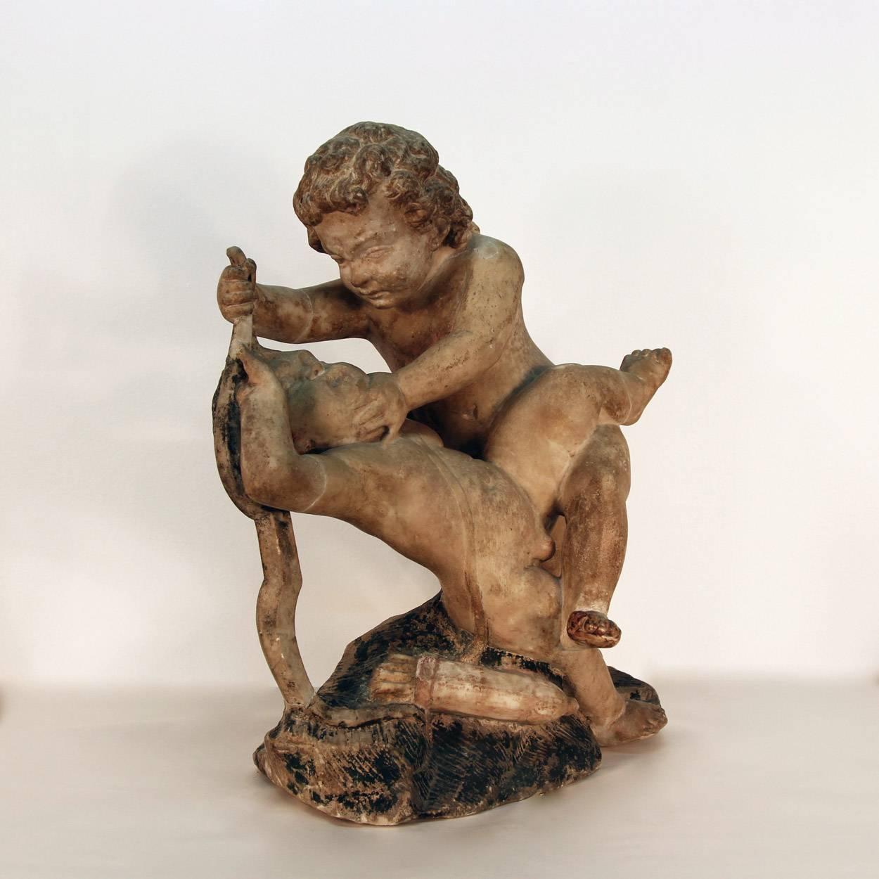 17th Century Sculpture of Putto at Play For Sale 5