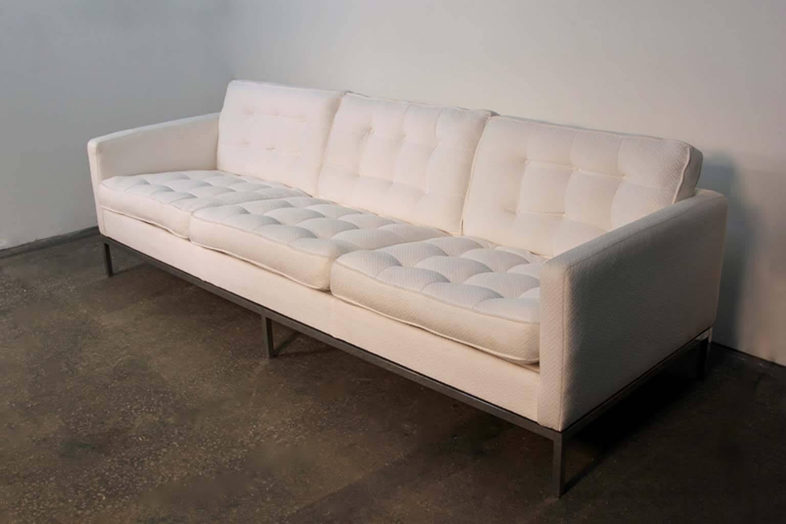 Florence Knoll designed three-seat sofa. White upholstery, with box stitching. Sits on chrome legs. In good condition, nice example of Mid-Century Modern design by Florence Knoll for Knoll Company.