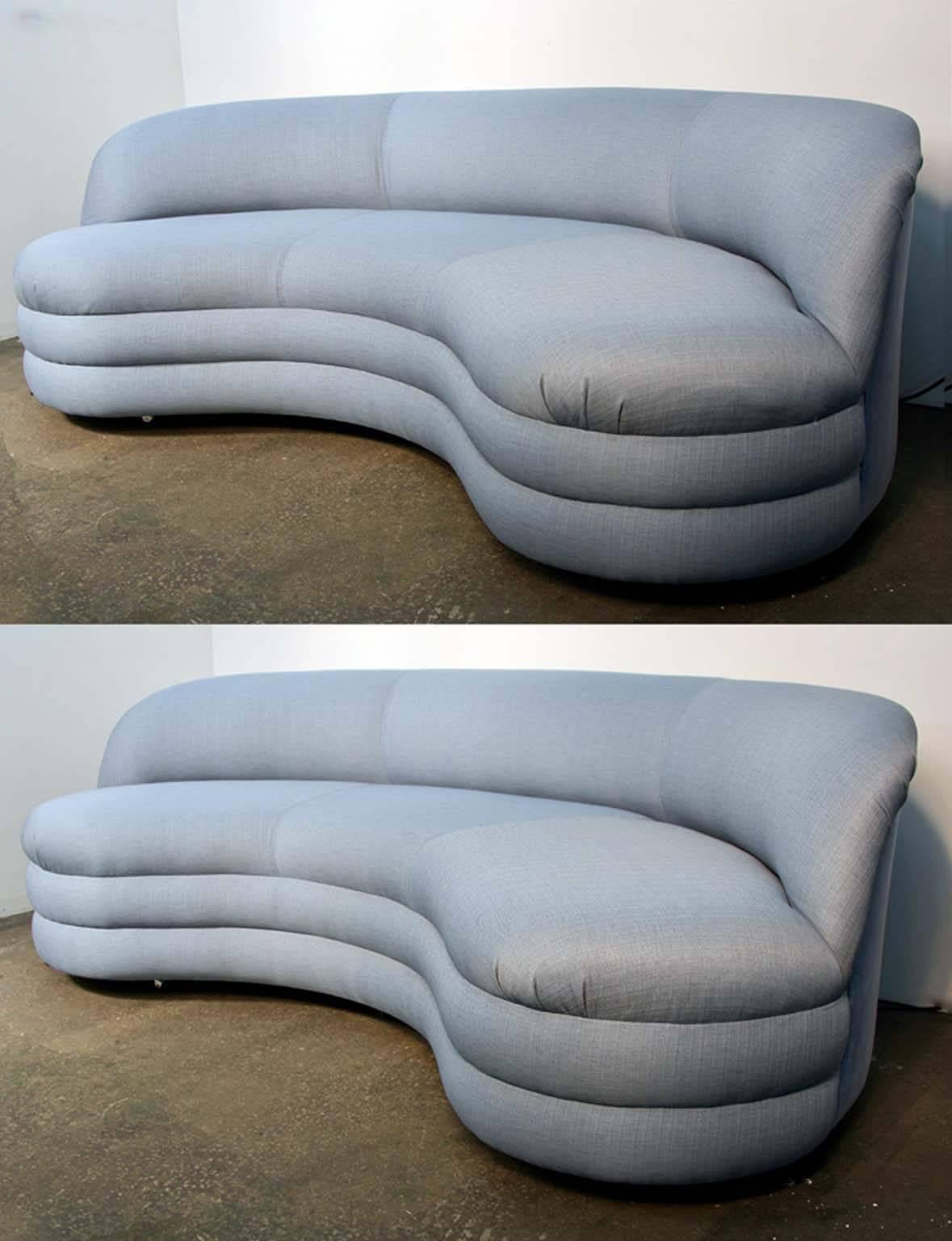 Amazing pair of sofas attributed to Vladimir Kagan for Directional. Brand newly upholstered in blue woven fabric front and matching velvet back. Meticulously done. 