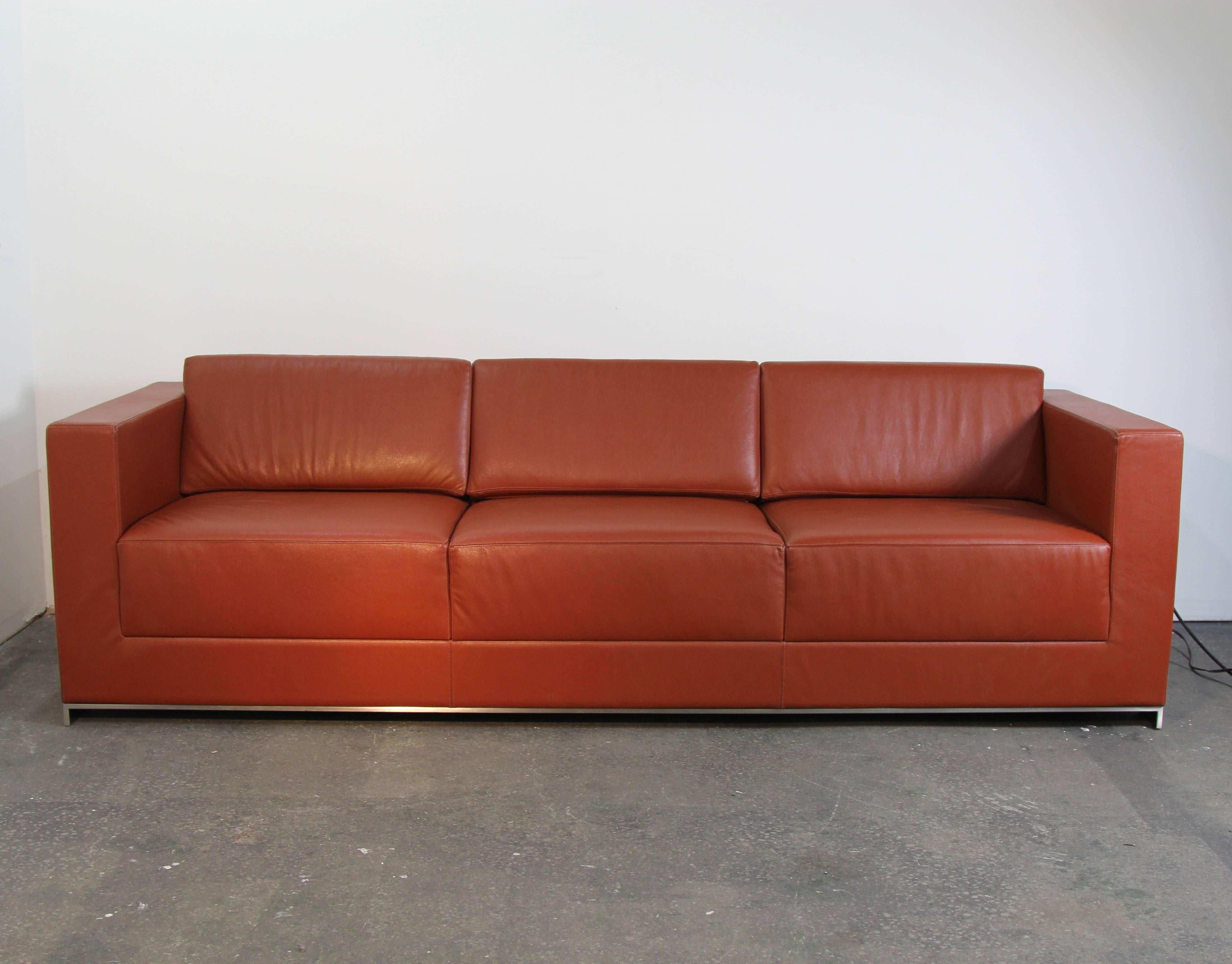 Bernhardt saddle leather three-seat sofa on brushed chrome frame. Modern, square arm leather sofa. On Brushed steel frame.