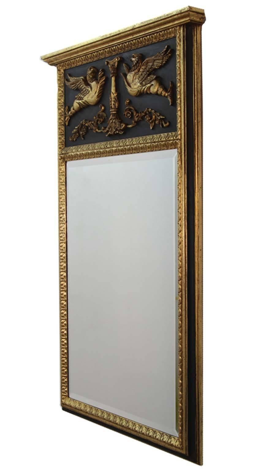 Black and gold trumeau with original bevelled mirror plate.