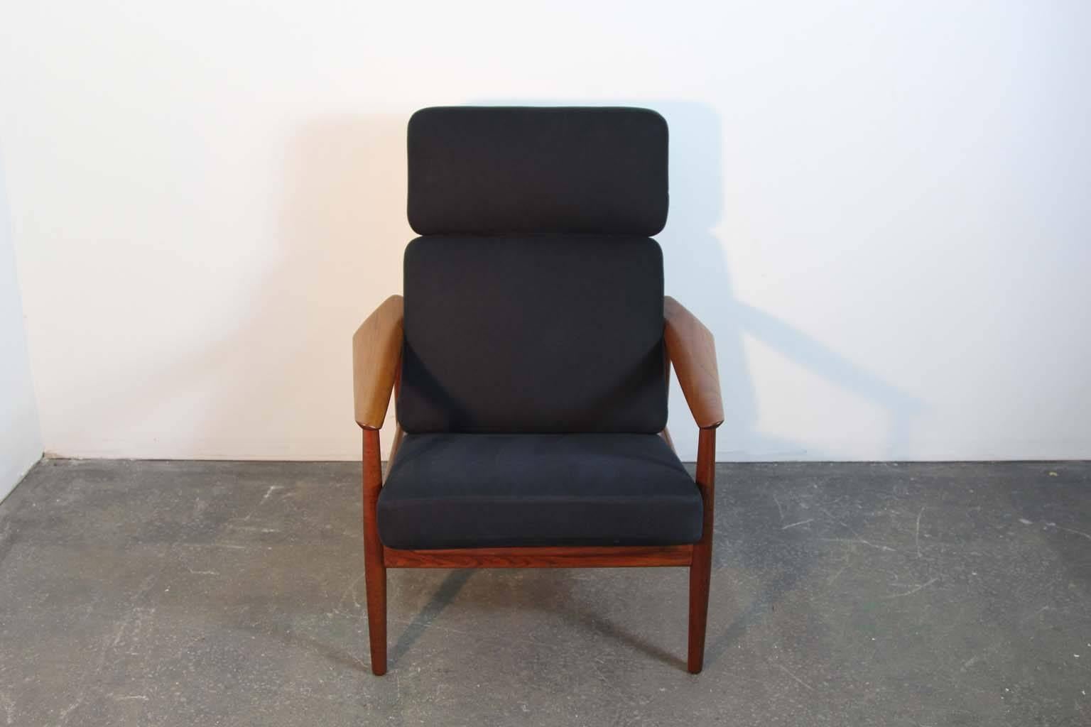Vintage Arne Vodder high back teak lounge chair, reclinable in three positions. Refinished solid teakwood frame. Original seat loop springs in good condition showing minor wear. Original black fabric upholstery in excellent condition with little to