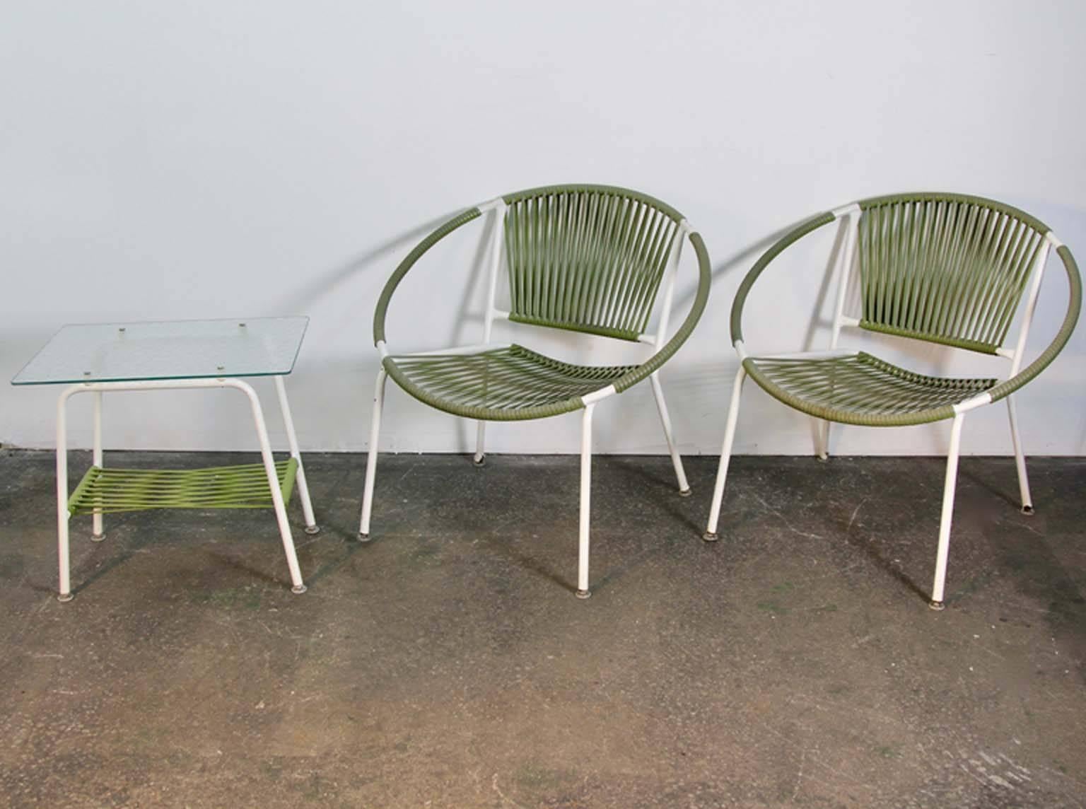 Mid-Century pair of hoop lounge chairs with pebble glass beverage table.