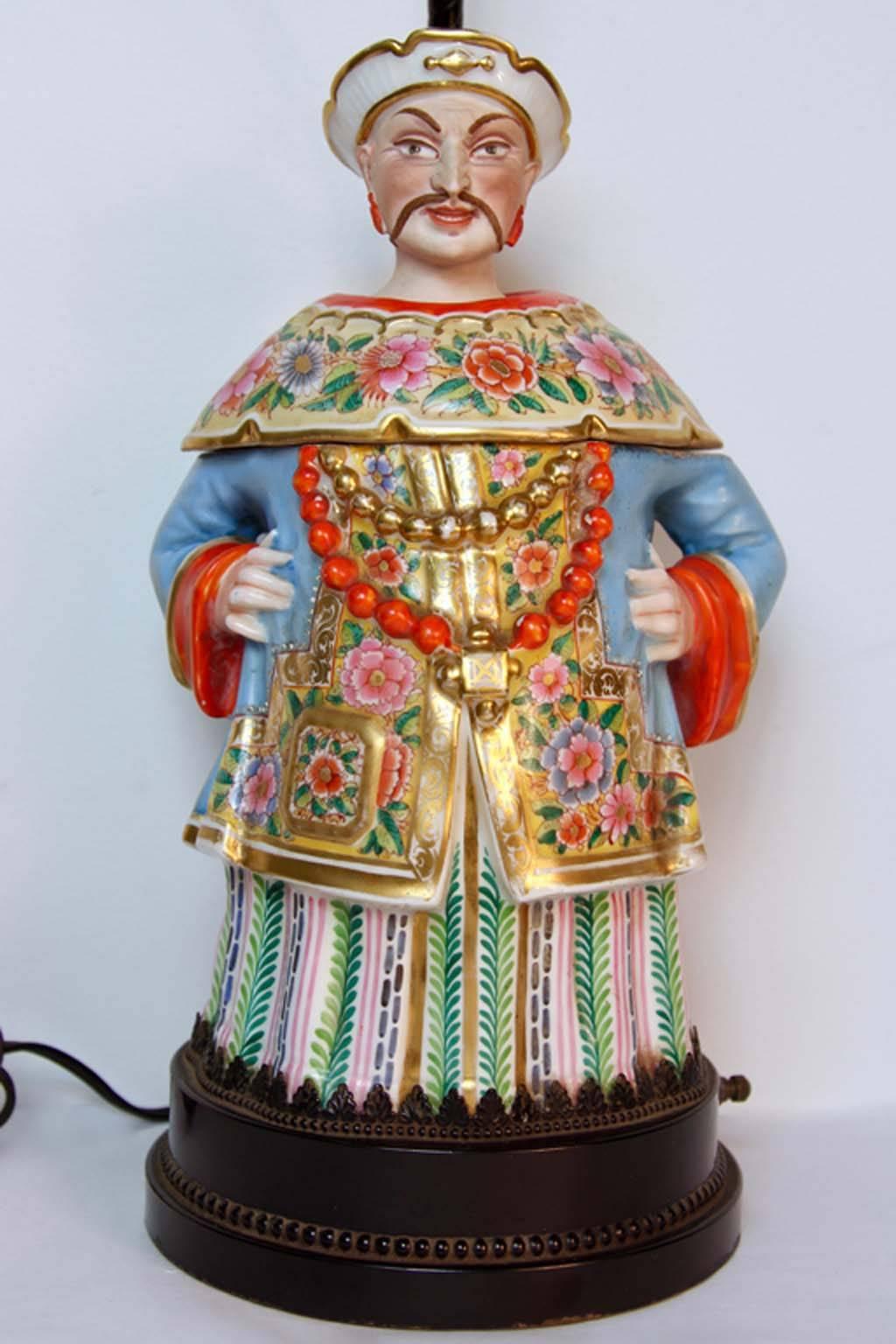 A very rare large museum quality antique porcelain China man two-piece figure from the 1800s. Later mounted on a museum Stand and turned into a lamp. The porcelain figure has not been drilled or compromised in any way, still in all original