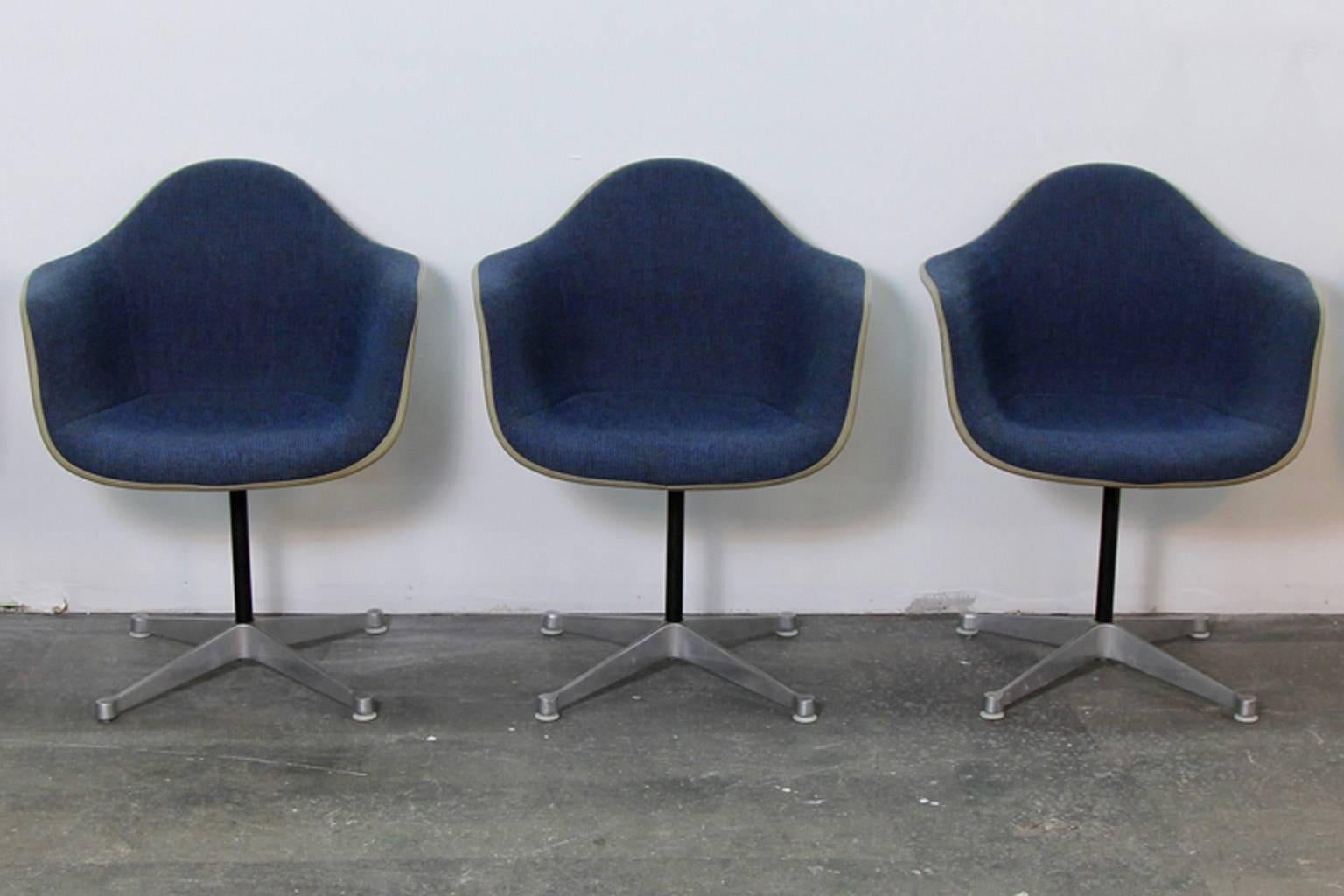 Incredible set of ten Herman Miller Shell chairs. All stamped Herman Miller, most with original upholstery tags. Navy woven fabric upholstery. On 4 Star swivel bases. In excellent condition with some light scratches commensurate with age. Upholstery