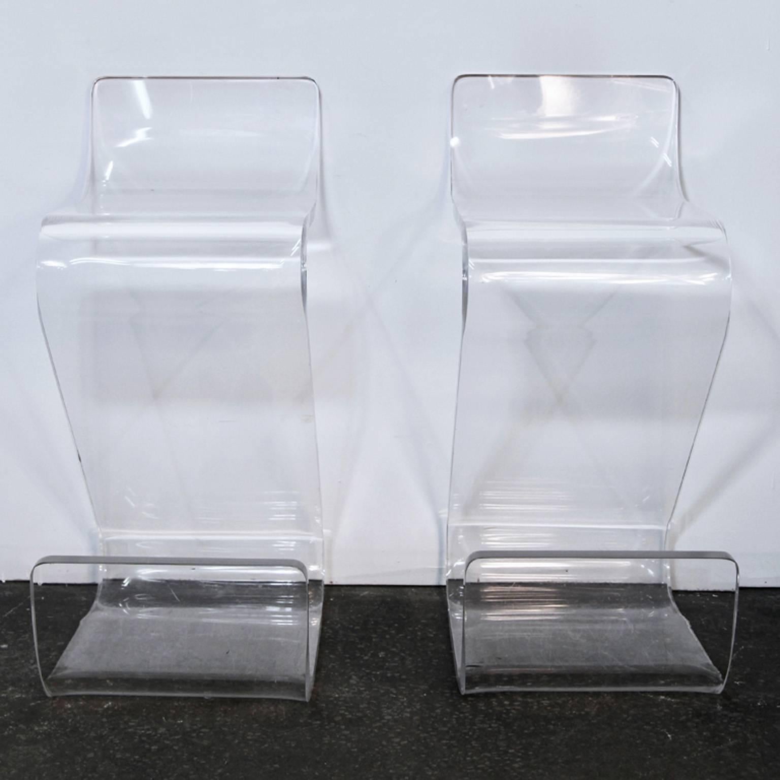 Incredible pair of Mid-Century Lucite Z-shaped stools. 1 inch thick Lucite. Very heavy. Rare set of stools that will make an amazing impression for any counter or bar area.