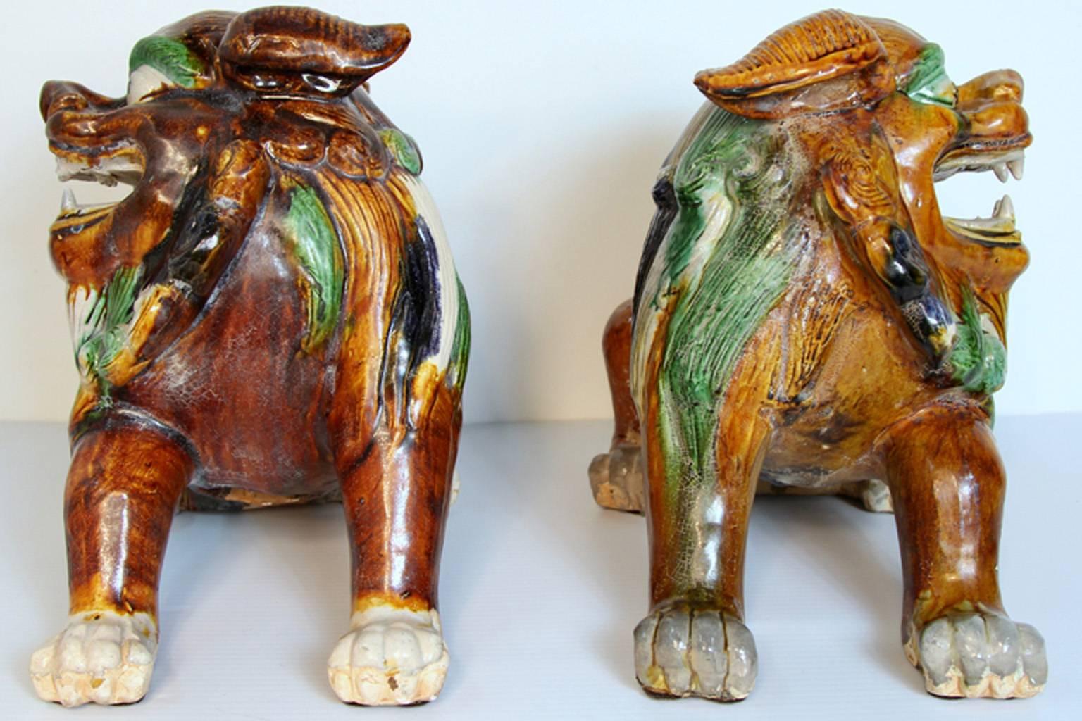 Pair of Mid-Century Sancai Glazed Foo Dogs In Good Condition For Sale In Bridport, CT