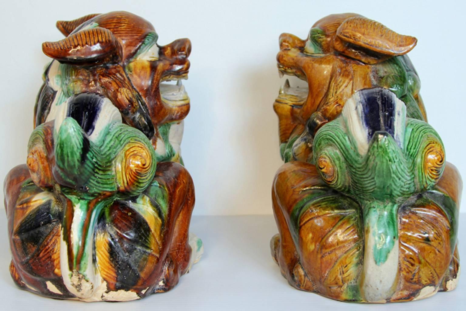 Terracotta Pair of Mid-Century Sancai Glazed Foo Dogs For Sale