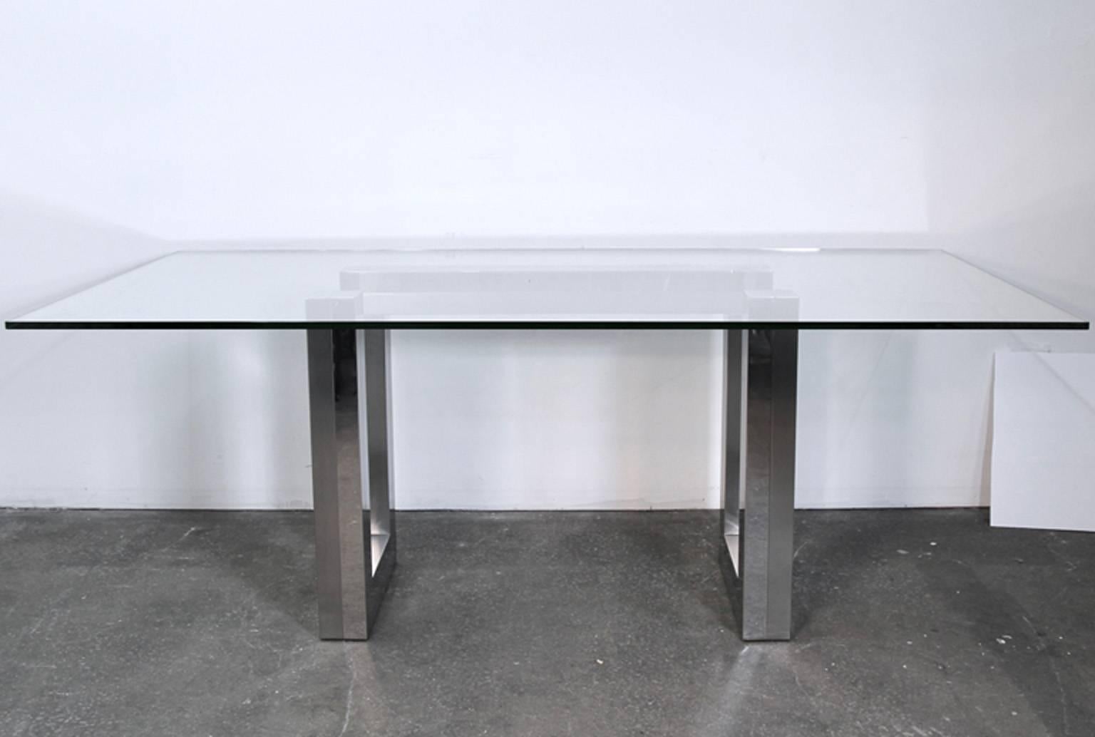 Mid Century chrome case dining table with glass top. Very much in the style of Paul Evans cityscape or Ello designs. Could be one of the two, but don't know for certain. Base is heavy and glass sits on top. Glass can be swapped out for different